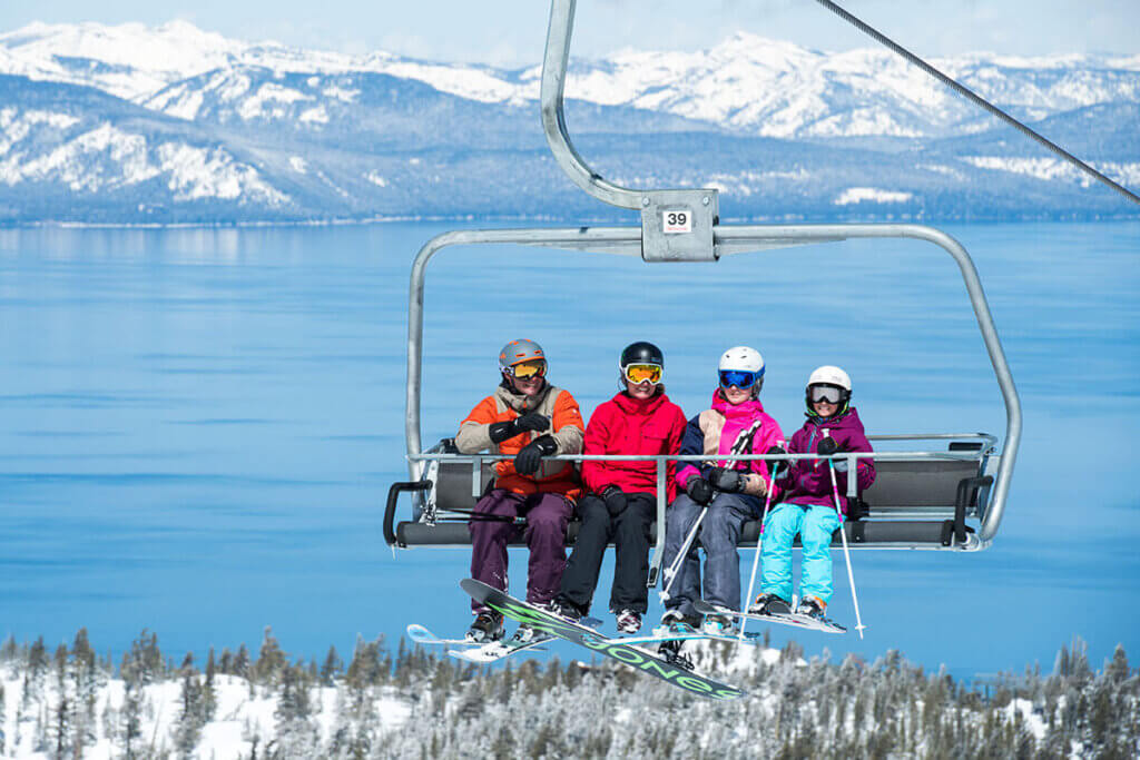 People on a ski lift at Heavenly Mountain Resort, a South Lake Tahoe ski resort