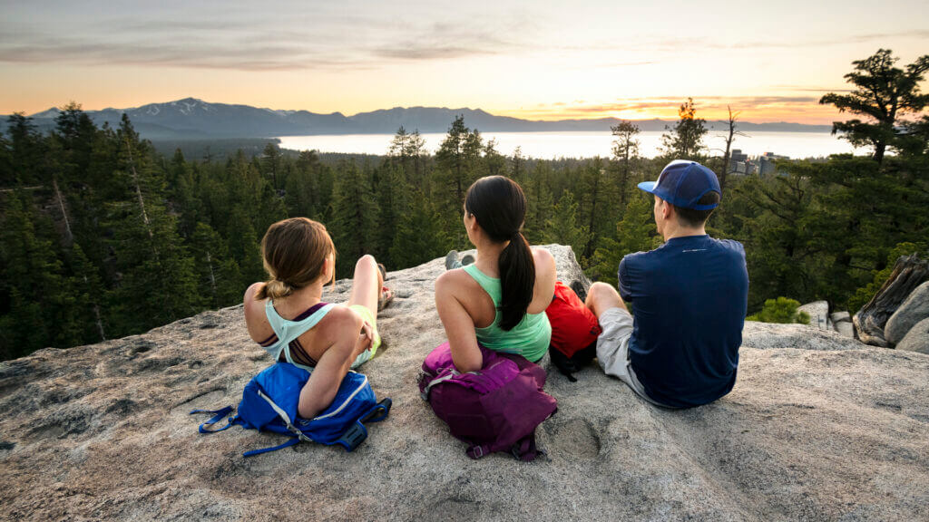 Hikers watching the sunset over Lake Tahoe - Rachid Dahnoun / LTVA